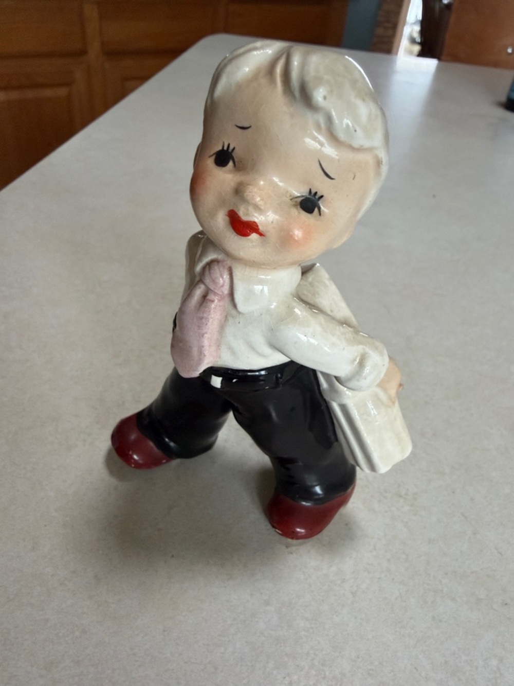 Vintage Ceramic Boy Figurine in Cream, Black and Red